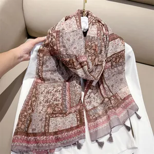 Detailed view of vintage ethnic cotton feel scarf featuring paisley print and tassels
