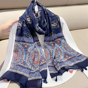 Detailed view of navy vintage paisley print scarf with ethnic floral pattern and tassels
