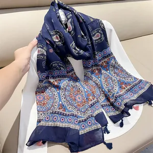 Elegant navy blue paisley print scarf with ethnic floral patterns and delicate tassels
