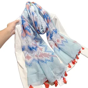 Retro ethnic style cotton linen feel scarf with blue floral print and orange tassels
