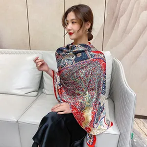 Elegant Asian model wearing a luxurious silk satin shawl with vintage floral patterns
