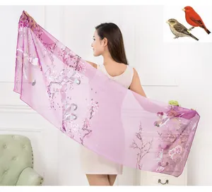 Detail of purple chiffon scarf featuring elegant bird and floral print for women