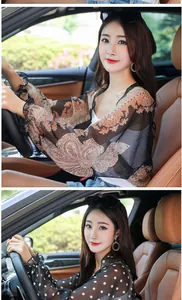 Detailed view of women's chiffon sun protection shawl with paisley print for driving