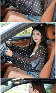 Detail view of black polka dot chiffon sun protection shawl for driving UV protection