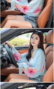 Detailed view of women's floral chiffon sun protection shawl for driving