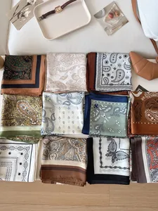 Collection of vintage paisley silk square scarves in assorted colors and patterns