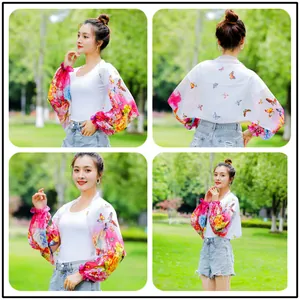 Detailed view of white chiffon sun protection shawl with colorful butterfly print