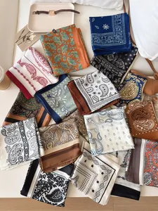 Collection of vintage paisley silk scarves with elegant patterns and rich autumn colors