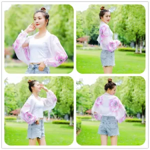 Versatile chiffon sun protection shawl with purple floral print for summer beach wear.