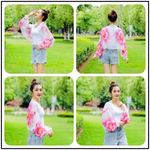 Detailed view of a stylish floral chiffon sun protection shawl shown in an outdoor park