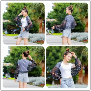 Four detailed views of a women's black polka dot chiffon sun protection shawl on a model.