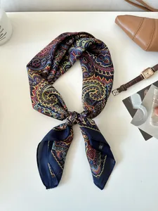 Close-up of retro paisley silk scarf with elegant knotting detail for fashion styling