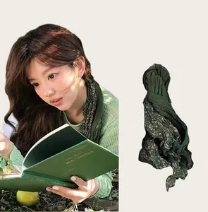 Detail of vintage dark green floral long scarf shown with lifestyle model view