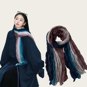 Detail showing the pleated texture and gradient colors of the vintage long scarf.