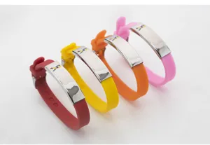 Close-up of silicone and stainless steel autism awareness bracelets in four colors