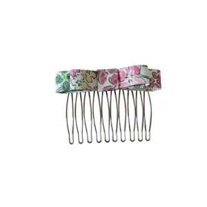 Korean style floral bow hair comb for fringe and hair volume styling on white background