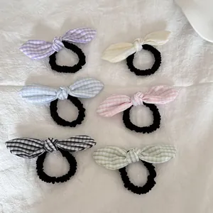 Juego de seis coleteros con lazo a cuadros vichy en suaves colores pastel para niñas