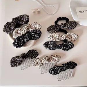 Detail view of vintage floral bow hair clips, scrunchies, and combs set for girls