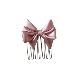 Peine para el cabello con lazo de satén rosa para peinar flequillos y mechones.