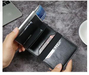 Detailed view of open RFID blocking wallet with automatic card ejector showing card slots