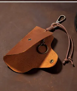 Detailed macro view of a vintage Crazy Horse leather key case showing internal ring
