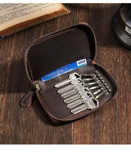 Detail view of a vintage crazy horse leather key wallet with card holder and key hooks