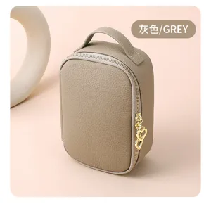 Grey litchi grain leather cosmetic bag with golden heart zipper pull