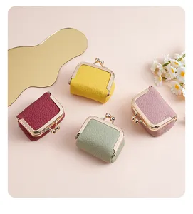 Mini genuine leather jewelry pouches with gold clasps in four assorted colors
