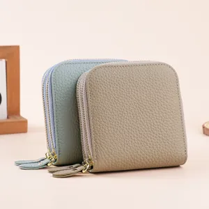 Genuine leather jewelry storage bag with double zippers and pebbled texture in soft colors