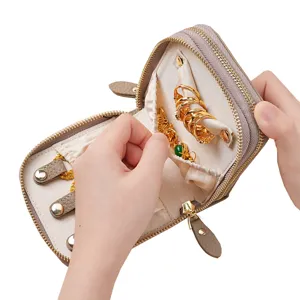 Compact portable genuine leather jewelry storage bag with double zipper and ring holders