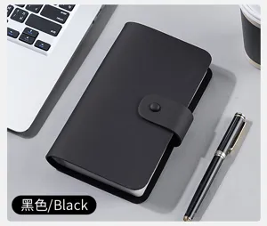 Elegant black leather collector album for coins and receipts shown on desk workstation
