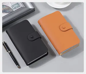 Premium leather collection albums for coins and checks in black and tan finish.