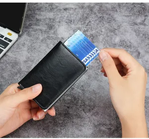 Action shot showing the automatic pop-up mechanism of the RFID blocking cardholder