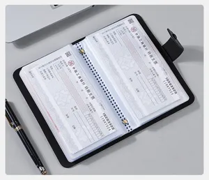 Detail view of internal transparent PVC sleeves in a leather check collection binder