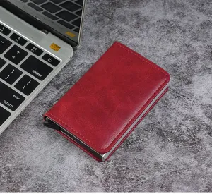 Macro detail view of red RFID blocking credit card holder with pop-up lever