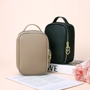 Premium lychee pattern genuine leather cosmetic bag featuring a gold heart zipper pull