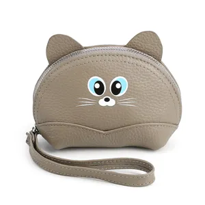 Lindo monedero de gato en cuero gris con ojos azules y correa de muñeca extraíble.