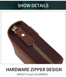 Nahaufnahme des hochwertigen Metallreißverschlusses einer braunen Leder-Clutch-Tasche.