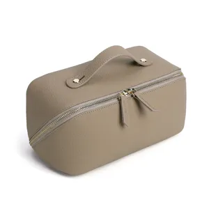 Elegante Kosmetiktasche aus echtem Leder in Taupe mit Tragegriff und Doppelreißverschluss