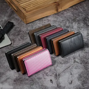 RFID blocking aluminum card holder with carbon fiber pattern and automatic pop-up feature
