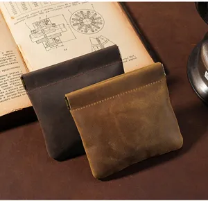 Two Crazy Horse leather mini pouches with spring clip closure in brown and tan colors