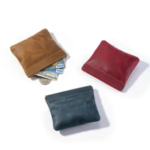 Set of three mini Crazy Horse leather squeeze top coin pouches in brown red and blue