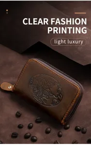 Close-up view of vintage brown leather card holder with detailed embossed dragon motif