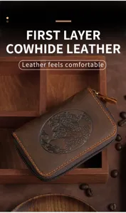 Detailed macro shot of vintage brown cowhide leather card holder with dragon embossing