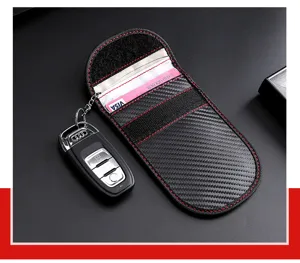 Detail of carbon fiber RFID signal blocking car key pouch with red stitching