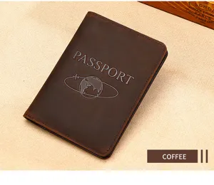 Close-up of coffee crazy horse leather passport holder with embossed passport logo.