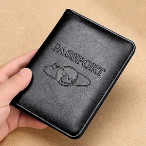 Classic black leather passport holder cover with embossed globe and world travel design