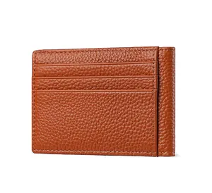 Detailed view of a slim brown pebbled leather card holder with multiple credit card slots