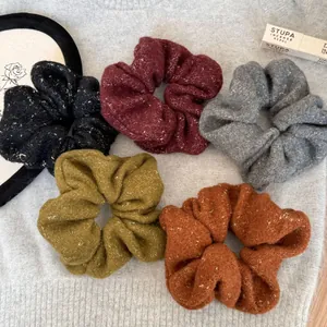 Cozy plush scrunchies set in five autumn colors with gold thread detail