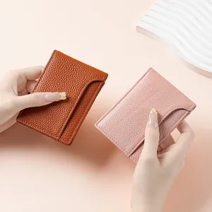 Ultra-thin litchi grain genuine leather card holders shown in brown and pink colors